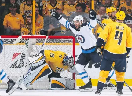  ?? FREDERICK BREEDON/GETTY IMAGES ?? Winnipeg forward Paul Stastny celebrates a goal against the Predators’ Pekka Rinne on Thursday at Bridgeston­e Arena in Nashville, Tenn., as the Jets advanced to their first Western Conference final with a 5-1 victory in Game 7 of the second-round series.