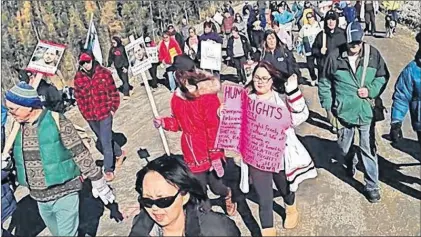  ?? SALTWIRE NETWORK FILE PHOTO ?? Protesters walk onto the Muskrat Falls worksite in Labrador in October 2016.