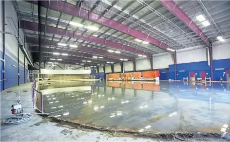  ?? JULIE JOCSAK/STANDARD STAFF ?? The two remaining rinks at Seymour-Hannah Sports and Entertainm­ent Centre were re-poured over the past week. The concrete floors of all four rinks at the complex needed extensive repair work.