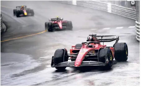  ?? AP ?? No starting trouble:
Ferrari driver Charles Leclerc of Monaco leads his teammate Carlos Sainz of Spain and Red Bull driver Sergio Perez of Mexico at the start of the Monaco Formula One Grand Prix.