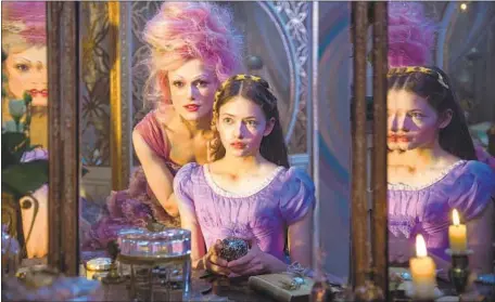  ?? Laurie Sparham Walt Disney Pictures ?? KEIRA KNIGHTLEY, left, stars as the Sugar Plum Fairy, with Mackenzie Foy as young Clara in Disney’s family adventure fantasy.