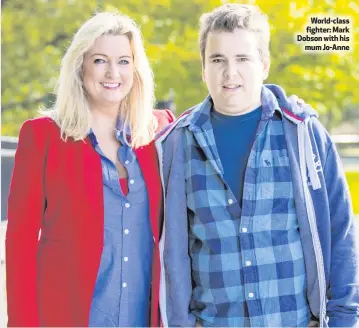  ??  ?? World-class fighter: Mark Dobson with his
mum Jo-Anne