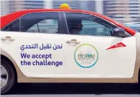  ??  ?? A Dubai taxi spreads the message of the Dubai Fitness Challenge.
