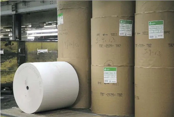  ?? ANDREW HARRER/BLOOMBERG FILES ?? Resolute Forest Products newsprint rolls sit on the floor at the Washington Post newspaper facility in Springfiel­d, Va. The U.S. is expected to levy duties for imported paper in response to claims that firms like Resolute Forest Products get subsidies.