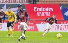  ?? AFP ?? AC Milan’s Franck Kessie scores a last-minute penalty against Udinese.