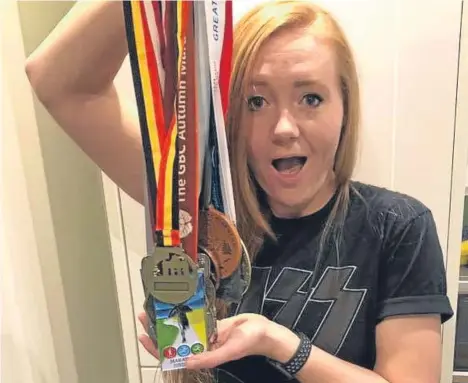  ??  ?? A DUNDEE woman tackled 17 mara- thons in 2017 in memory of her mum, who died of breast cancer.
Jenna Maudlin’s mum Carolyn died just a week after being diagnosed with the condition, leading the 32-year-old to launch a fundraisin­g campaign.
Jenna...