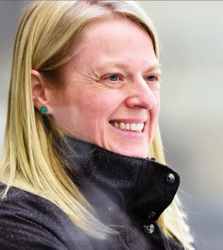  ?? DON HEALY ?? University of Regina Cougars head coach Sarah Hodges smiles during a game against the University of Calgary Dinos at the Co-operators Centre in Regina.