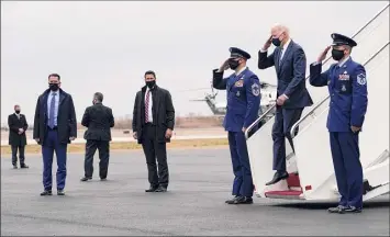  ?? Carolyn Kaster / Associated Press ?? President Joe Biden salutes as he arrives on Air Force One at Philadelph­ia Internatio­nal Airport in Philadelph­ia on Tuesday, en route to Chester, Pa.