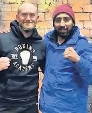  ??  ?? Trevor Abraham (left) with Muhameed Mayat, owner of No Excuse Workouts in Accrington