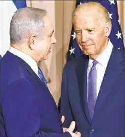  ?? Michel Euler Associated Press ?? ISRAELI Prime Minister Benjamin Netanyahu, left, and then-Vice President Joe Biden meet in 2016 at the World Economic Forum in Davos, Switzerlan­d.