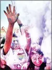  ??  ?? A crowd celebrants toss colored powder into the air during the Festival of Colors at the India Cultural Center and Temple on April 2, in Memphis, Tenn. Throwing color is a traditiona­l Hindu way to enthusiast­ically embrace the changing season and...