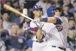  ?? AP PHOTO ?? Chicago Cubs’ Miguel Montero watches his two-run home run off Milwaukee Brewers starting pitcher Jimmy Nelson during the fourth inning of a baseball game Tuesday in April in Chicago.