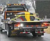  ??  ?? Michael House’s casket was secured to a K & S flatbed tow truck as it arrived at Westminste­r Cemetery.