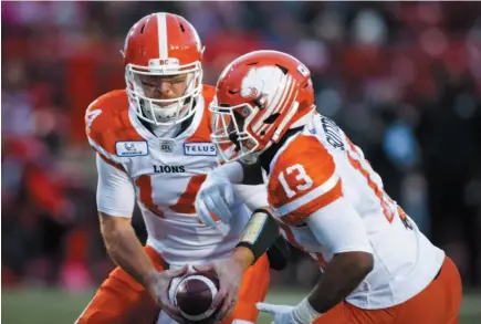  ?? CP FILE PHOTO ?? BC Lions quarterbac­k Travis Lulay hands the ball off to Tyrell Sutton during a game against the Calgary Stampeders in Calgary on Oct. 13. Lulay and the Lions face off against the Saskatchew­an Roughrider­s today.