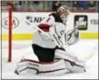  ?? TOM MIHALEK — THE ASSOCIATED PRESS ?? Devils goalie Keith Kinkaid turns away a shot on goal during the second period of a game against the Flyers in Philadelph­ia on Saturday, Oct. 20.