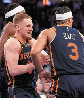  ?? ?? Well done: Josh Hart (right) of the new york Knicks is congratula­ted by teammate donte divincenzo after scoring the game’s winner against the detroit Pistons at Madison square Garden on Monday. — AFP