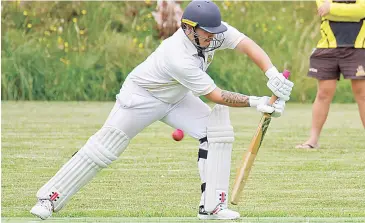  ??  ?? Korey Carrison battles against the spin bowling of Jindivick as this ball beats the edge of the bat in division two.