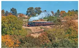  ?? ?? Autumnal colours steal the show as No. 7820 Dinmore Manor approaches Stanway Viaduct.