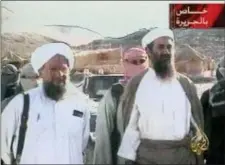  ?? AL-JAZEERA VIA APTN ?? This television image released by Qatar’s Al-Jazeera television broadcast on Friday at an undisclose­d location. At left is bin Laden’s top lieutenant, Egyptian Ayman alZawahri.