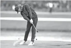  ?? Gerald Herbert/Associated Press ?? ■ Tommy Fleetwood of England hits from the sixth fairway during the final round of The Players Championsh­ip golf tournament Sunday in Ponte Vedra Beach, Fla.