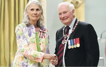  ?? JUSTIN TANG / THE CANADIAN PRESS ?? Poverty and homelessne­ss activist Jean Swanson of Vancouver is invested as a member of the Order of Canada by Governor General David Johnston in 2017.