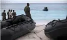  ?? Karumba/AFP/Getty ?? Navy divers look for debris of the crashed Yemenia Airlines plane. Photograph: Tony