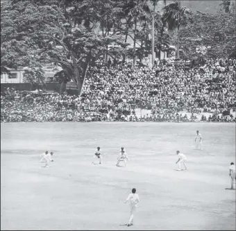  ?? ?? The picturesqu­e Queen’s Park Oval with the Northern Range in the background during a 1974 Test match between England and the West Indies (Photo: March 1974 issue of The Cricketer)