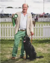  ??  ?? Anthony Sheppard with Newt, winner of best retrieve