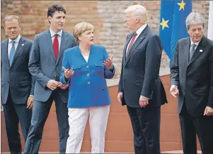  ?? AP PHOTO ?? G7 leaders (from left) EU President Jean-Claude Junker, Canadian Prime Minister Justin Trudeau, German Chancellor Angela Merkel, President Donald Trump, and Italian Prime Minister Paolo Gentiloni, pose for a family photo at the Ancient Greek Theater of...