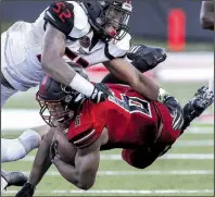  ?? Akansas Democrat-Gazette/MITCHELL PE MASILUN ?? Arkansas State running back Warren Wand (6) dives for extra yardage as Southeast Missouri State offensive lineman Omardrick Douglas (52) defends Saturday at Centennial Bank Stadium in Jonesboro. Plays like that helped add up to 685 yards of offense for the Red Wolves, who are focused on cleaning up a sloppy opening performanc­e.