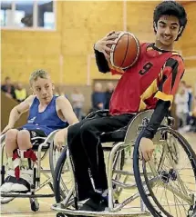  ??  ?? Yashan Randhawa playing wheelchair basketball for Team Waikato.