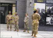  ?? Mariam Zuhaib Associated Press ?? TROOPS stand outside the Army National Guard office in Washington during training in April 2022.