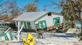  ?? MIAMI HERALD ?? Despite causing destructio­n like this in Fort Myers Beach, Hurricane Ian demolished fewer buildings than initially feared last month, insurance experts say. The bad news is the damage was enough to hike prices for everyone in Florida next year and beyond.