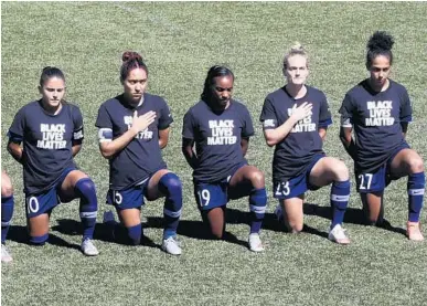  ?? RICK BOWMER/AP ?? North Carolina Courage players kneel Saturday during the national anthem before their NWSL game against the Portland Thorns.