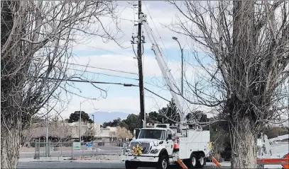  ?? Carri Geer ?? Las Vegas Review-journal NV Energy crews work on power lines and poles that came down Monday morning at Horizon and College drives in Henderson.