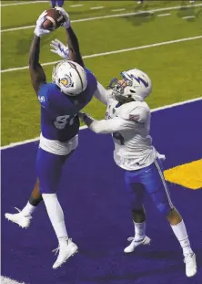  ?? Jeff Chiu / Associated Press ?? San Jose State’s Derrick Deese soars above Air Force’s Ethan Erickson for one of his two thirdquart­er TD catches Saturday.