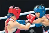  ?? AFP ?? German Nadine Apetz (L) fights with Lovlina Borgohain.