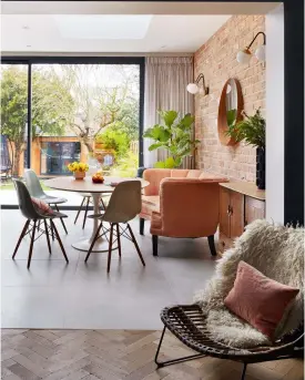  ??  ?? ZONING SPACES A flooring change – from concreteef­fect Mandarin Stone to Broadleaf Timber’s Vintage oak parquet – demarcates the transition from bright and open to a comfortabl­e retreat.