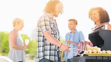  ??  ?? Lure helping hands with a barbecue, but be sure the work is done before the real fun begins. Photo / Getty Images.