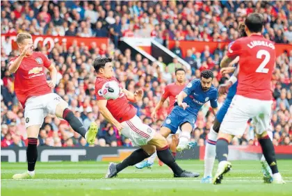  ?? Photo / Getty Images ?? Harry Maguire (centre) helped Manchester United keep a clean sheet on his debut.