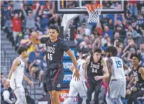  ?? L.E. BASKOW/ASSOCIATED PRESS ?? Gonzaga guard Rasir Bolton celebrates a 3-point basket against UCLA during the first half of Tuesday’s game in Las Vegas, Nev.