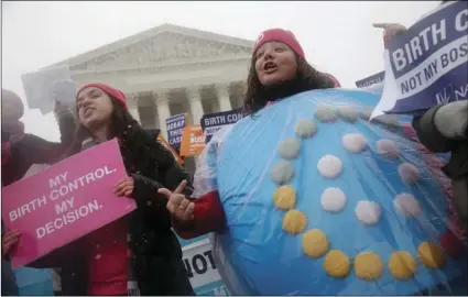  ??  ?? In this March 25, 2015, file photo, Margot Riphagen of New Orleans, La., wears a birth control pills costume during a protest in front of the U.S. Supreme Court in Washington. AP PHOTO/CHARLES DHARAPAK