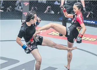  ??  ?? Japanese-Thai fighter Rika Ishige, right, during a recent bout.