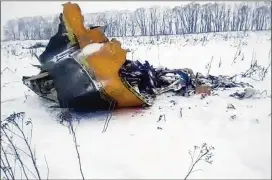  ?? LIFE.RU VIA ASSOCIATED PRESS ?? A piece of a wrecked AN-148 airliner lies on the ground near the Russian village of Stepanovsk­oye after it crashed shortly after takeoff Sunday. There were reportedly no survivors among its 65 passengers and six crew members.