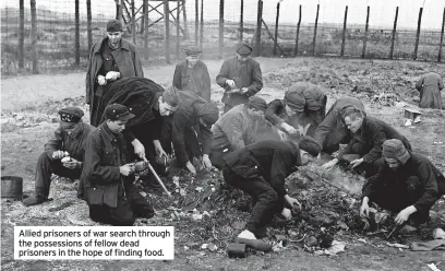  ??  ?? Allied prisoners of war search through the possession­s of fellow dead prisoners in the hope of finding food.