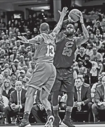  ?? AP Photo ?? Cleveland Cavaliers' LeBron James (23) shoots against Boston Celtics' Marcus Morris (13) in the first half of Game 3 of the NBA basketball Eastern Conference finals, Saturday, May 19, 2018, in Cleveland.