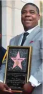  ??  ?? Comedian Tracy Morgan poses with his Hollywood Walk of Fame Star.
