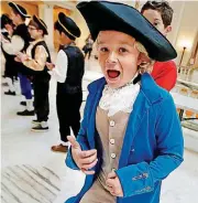  ??  ?? Moore fifth-grader Weston Abbey dances with students from Oakridge and Southgate elementary schools during Colonial Day at the state Capitol on Friday.