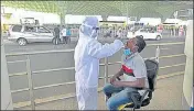  ?? HT PHOTO ?? A healthcare worker swab testing passengers at Chhatrapat­i Shivaji Maharaj Internatio­nal Airport, in Mumbai.