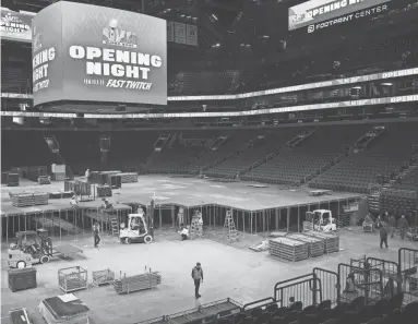  ?? ANTRANIK TAVITIAN/THE REPUBLIC ?? Workers put together a stage on Friday ahead of the Super Bowl Opening Night event at Footprint Center in Phoenix.